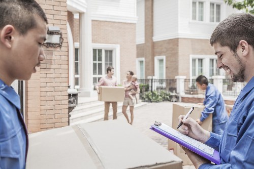 Furniture collection team handling bulky household items in Manor House