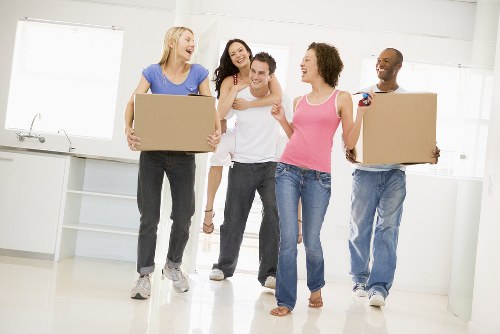 House movers working in a Manor House street with local flats and terraced homes