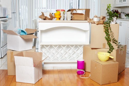Moving crew handling desks and boxes during an office relocation