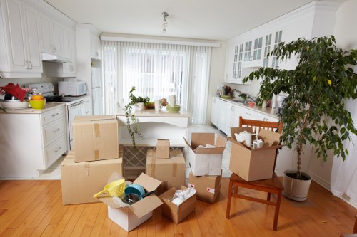 Removal van loading household items near Manor House